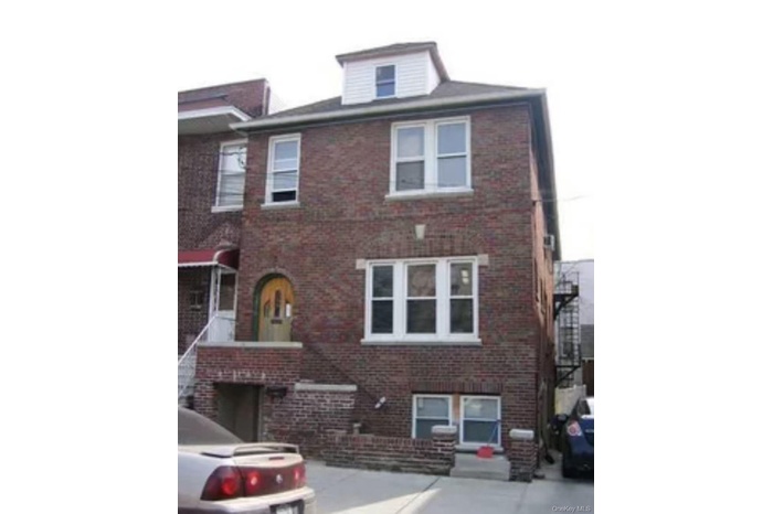 View of front of home featuring brick siding