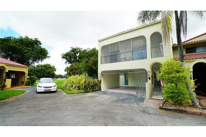 Front of home. Undercover parking for two cars in carport. Loads of guest parking.