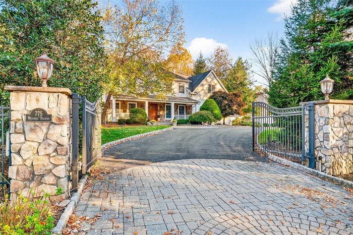 Front of home, driveway, electric gate