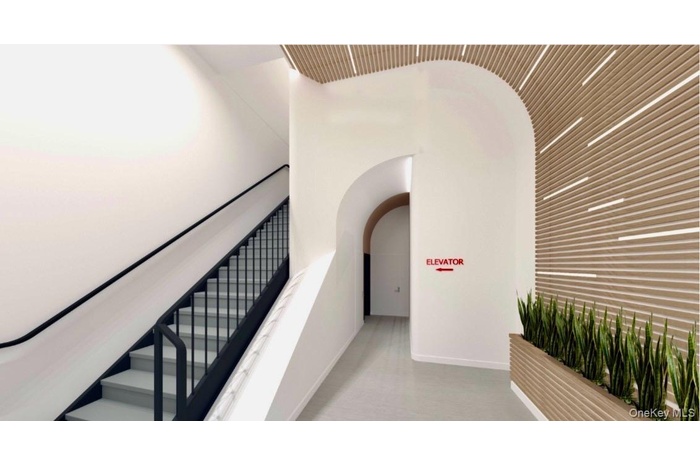 Stairway featuring carpet and arched walkways