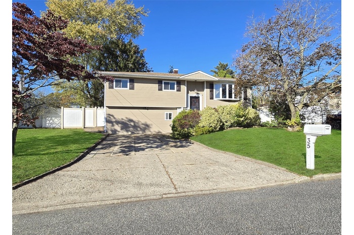 Raised ranch featuring a chimney