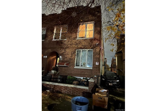 View of front of home featuring brick siding