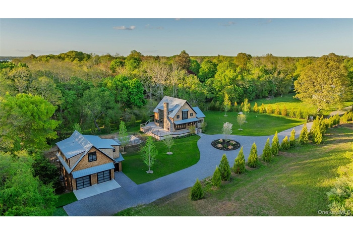 View from above of property featuring a wooded view