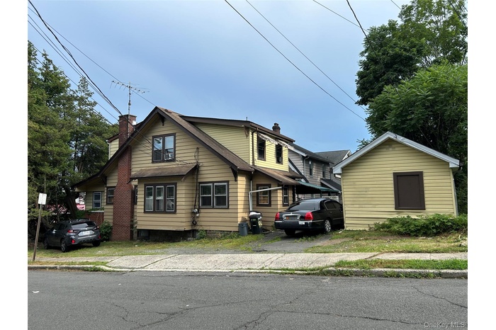 View of front of house with a chimney