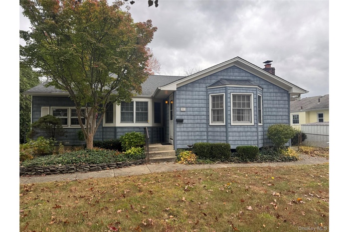 View of front of property with a chimney