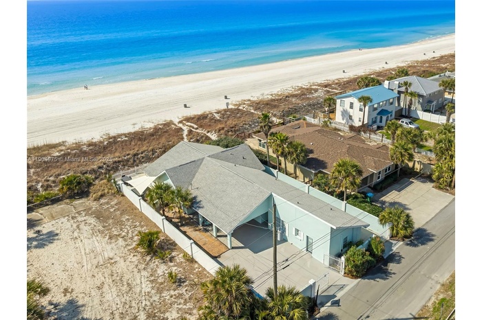 Private Gulf-front retreat — 60 ft of pristine shoreline and endless blue horizon views.