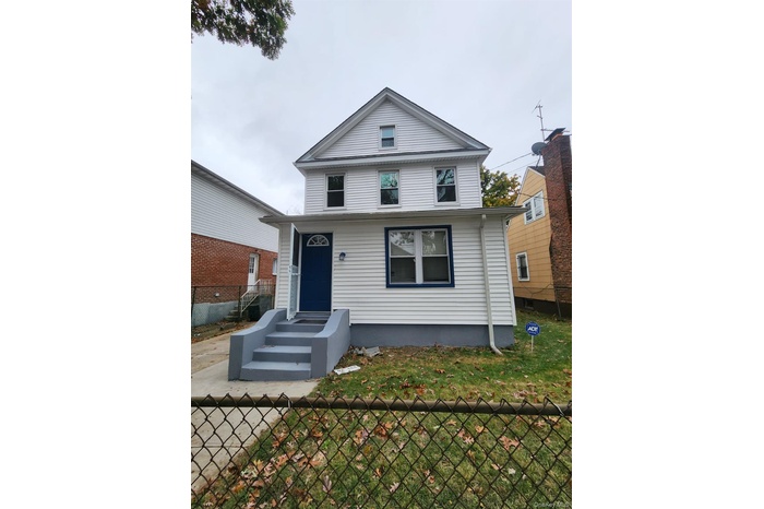View of front of house with a fenced front yard