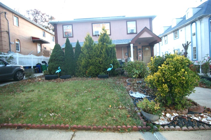 View of front of house with stucco siding