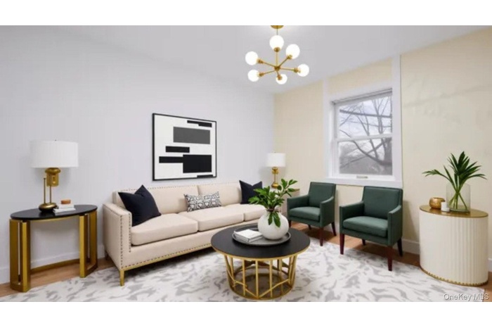 Living area with a chandelier and wood finished floors
