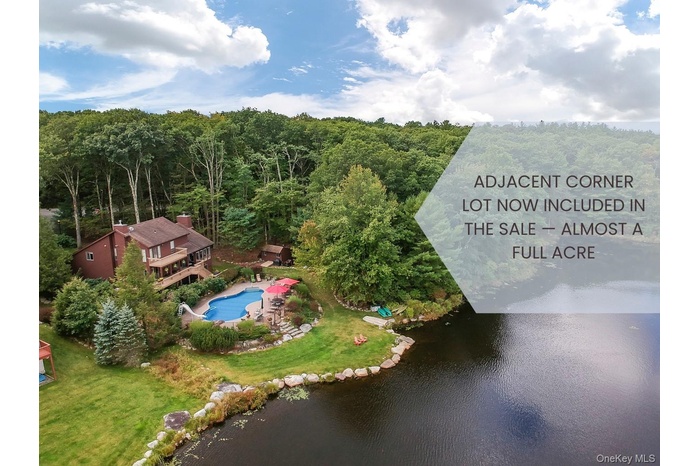 Bird's eye view of a heavily wooded area and a large body of water