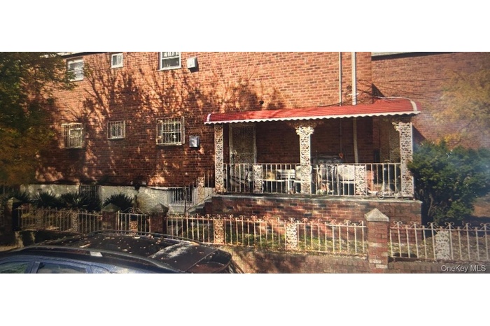 View of front facade featuring brick siding