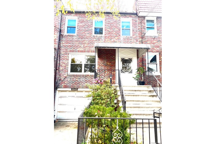 View of front of house with brick siding