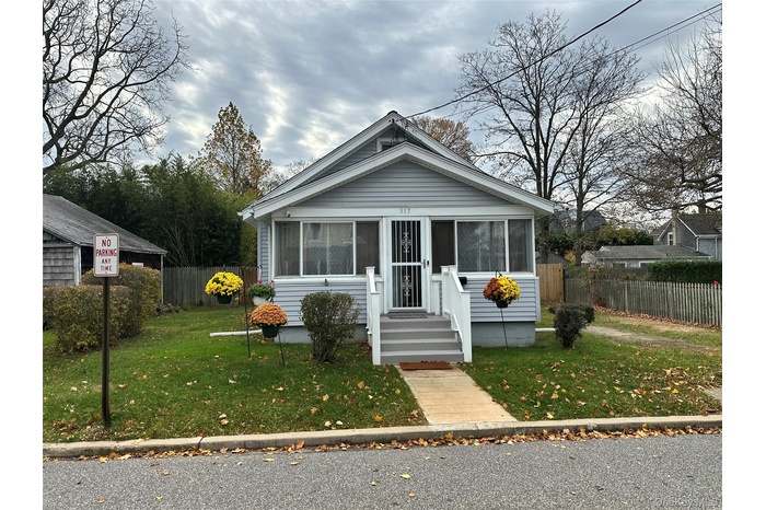 Bungalow-style home with a sunroom