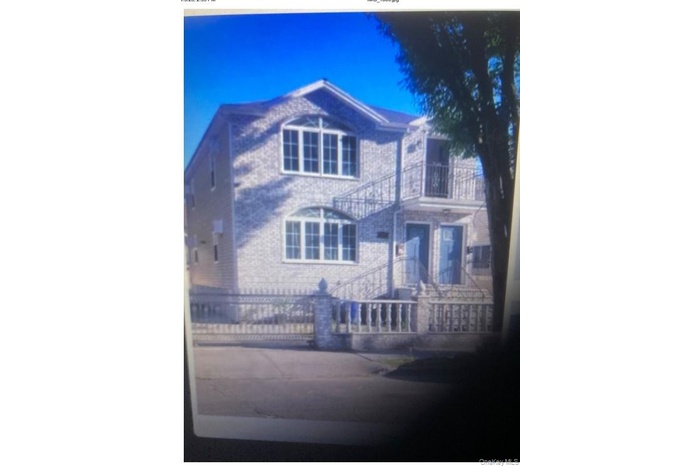 View of front of home with a balcony