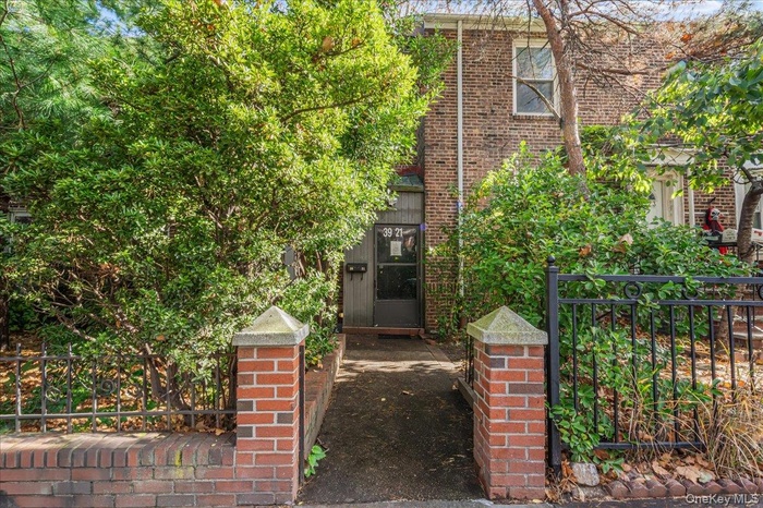 View of front of property featuring brick siding