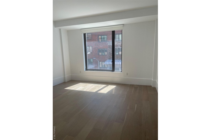 Empty room featuring wood finished floors