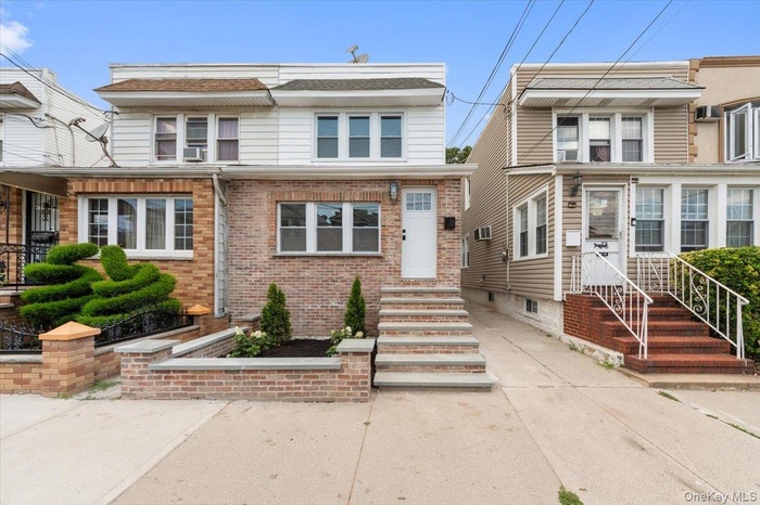 Traditional home featuring brick siding