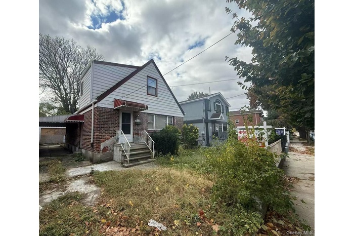 Bungalow with brick siding