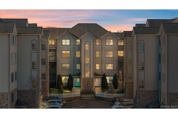 View of property at dusk