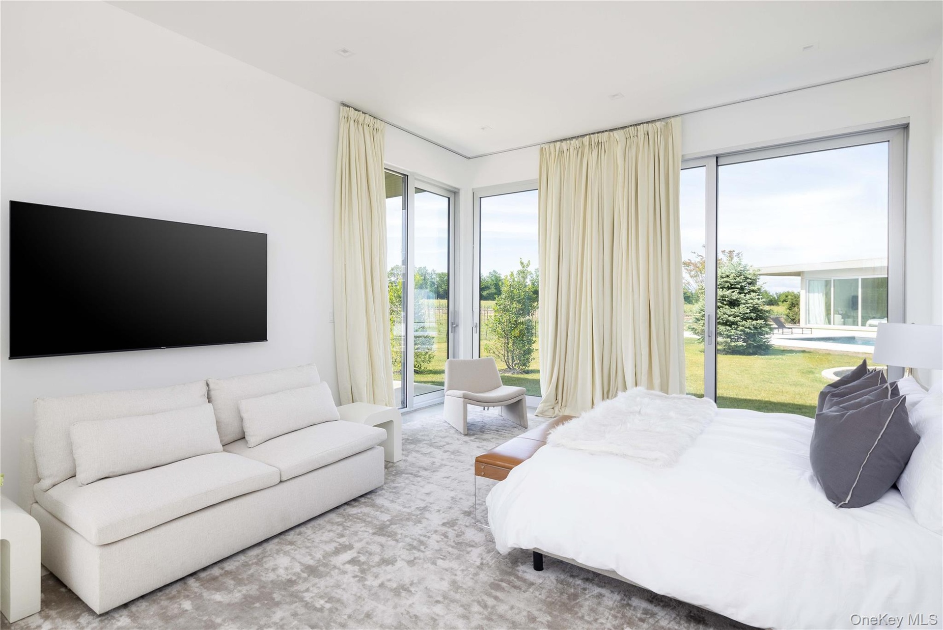 Carpeted bedroom with access to exterior