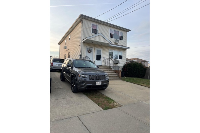 Traditional style home with an AC wall unit