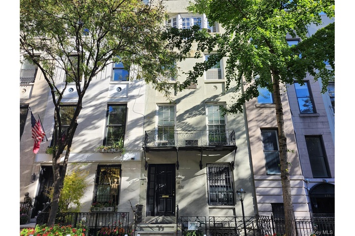 View of property featuring a fenced front yard