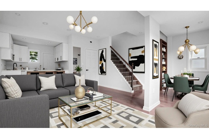 Living area featuring a chandelier, wood finished floors, stairs, and recessed lighting