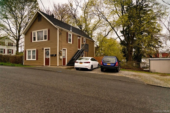 View of front of property featuring stairs