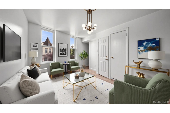 Living room featuring wood finished floors and a chandelier