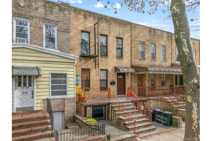 View of front of home featuring brick siding