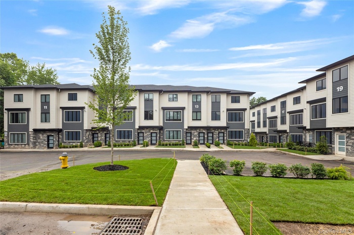 Surrounding community featuring a residential view and a yard
