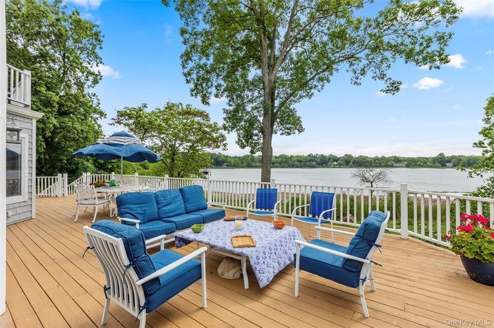 Enjoy outdoor dining area with views of Little Bay