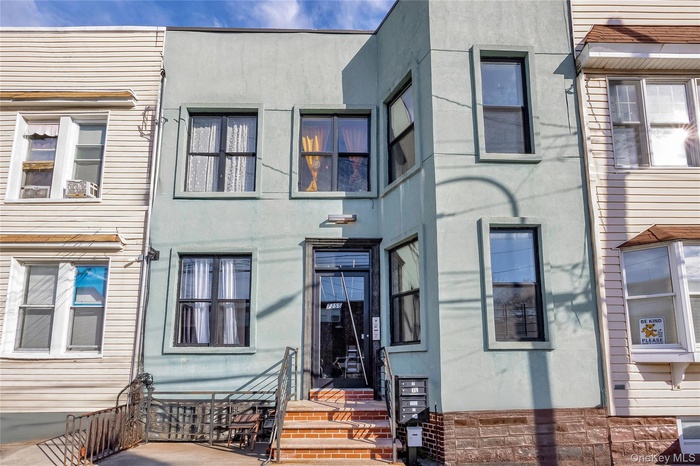 View of front of home featuring stucco siding