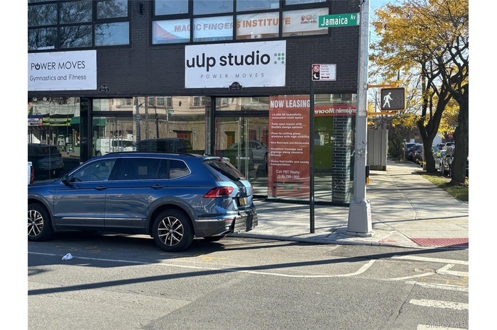 Entrance to property featuring brick siding