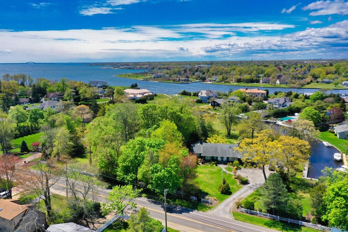 Aerial perspective with side canal and view of the Great South Bay