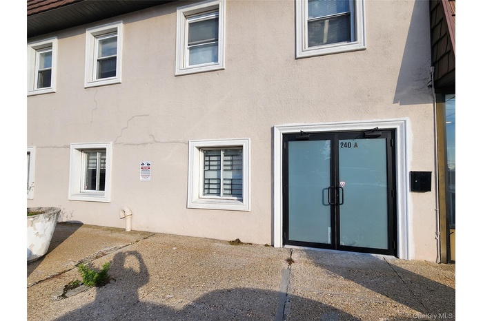 Rear view of house with stucco siding