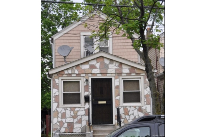 View of front facade with stone siding
