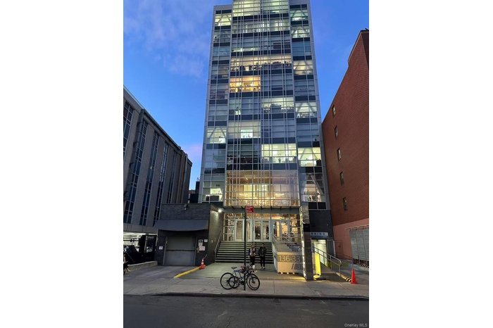 View of property at dusk