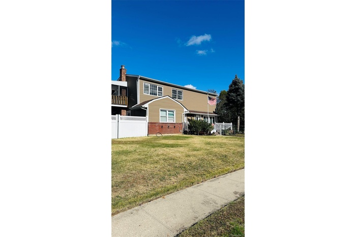 View of front of house with brick siding