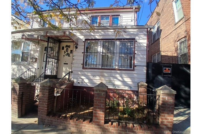 View of front of property with a fenced front yard