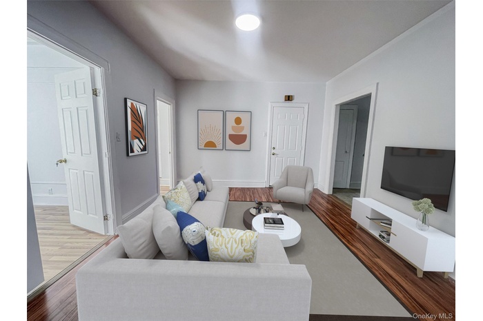 Living room featuring wood finished floors and baseboards