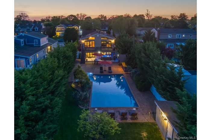 Aerial perspective of suburban area with a pool area