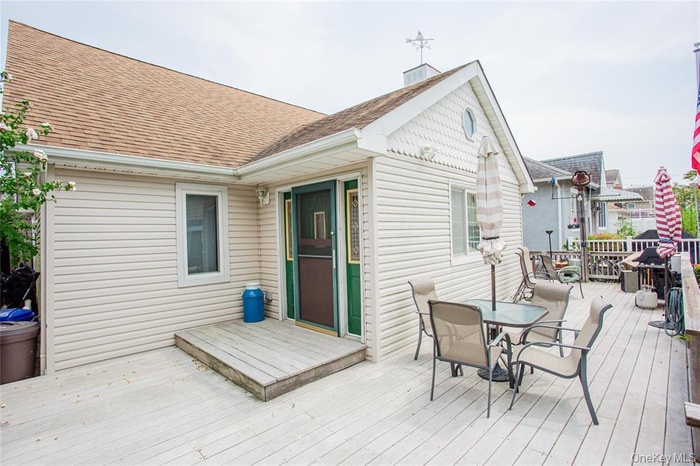 Wooden terrace with outdoor dining space
