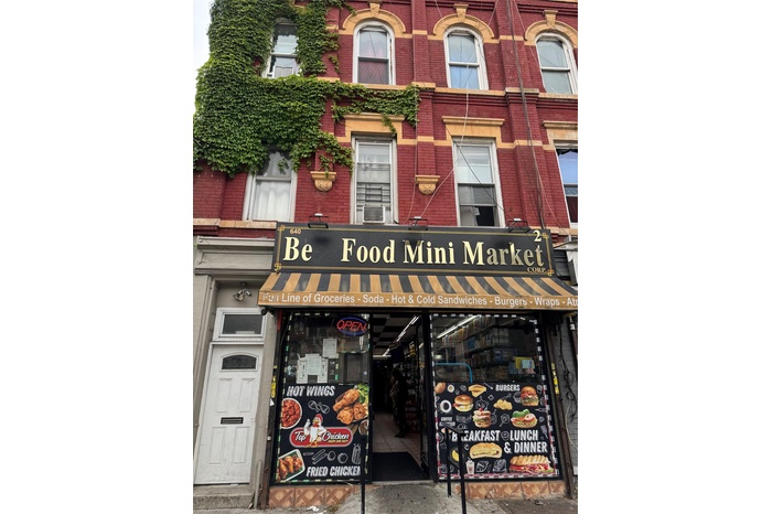 View of building exterior with cooling unit