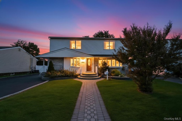 View of front of house featuring a front lawn