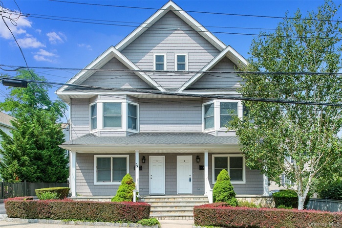 Welcome to 38 High Street! This lovely side-by-side home lives as a single family home, with four levels of space on the left side!