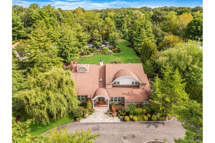 View from above of property with a forest