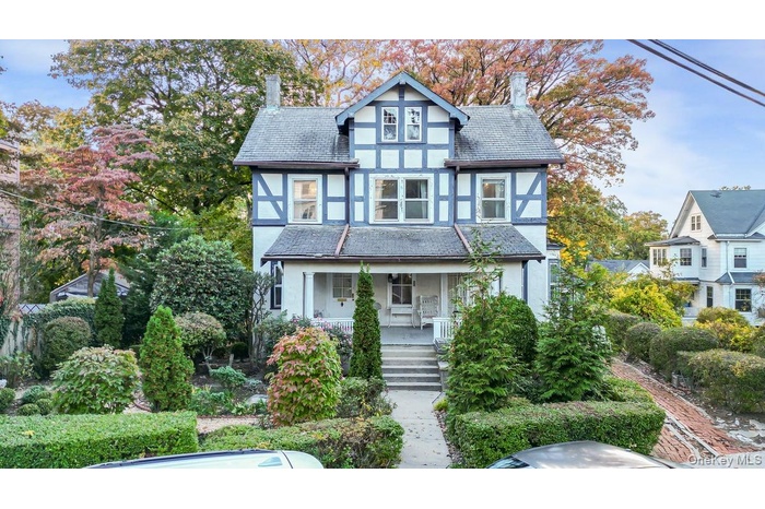 Picture Perfect Old English Tudor on a wonderful size Lot.