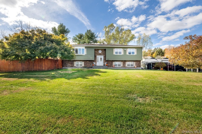 Split foyer home featuring brick siding
