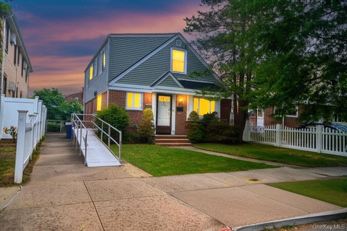 View of front of house featuring brick siding